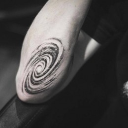 Tattoo in the style of dotwork. Galaxy, cosmic spiral. Universal inspiration.
